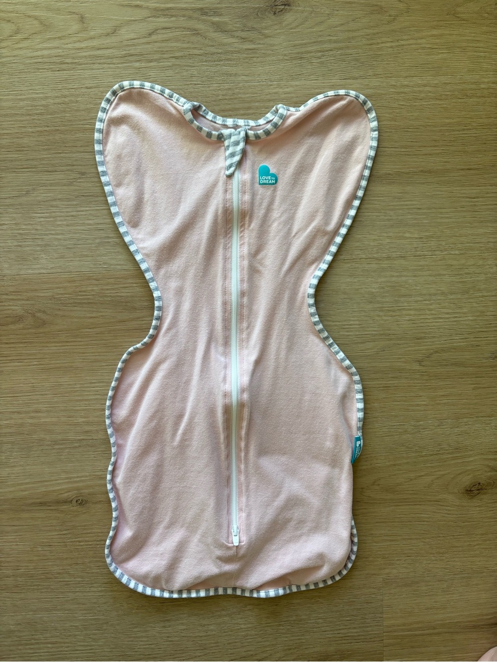 Love to Dream Light Pink Swaddle with Gray-White Stripe Binding
